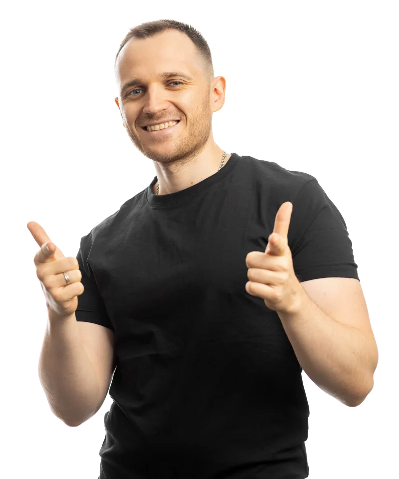 Andrei Koleda smiling and pointing at the viewer